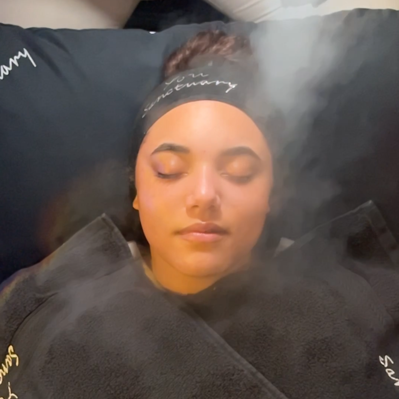 Woman getting a facial with steam