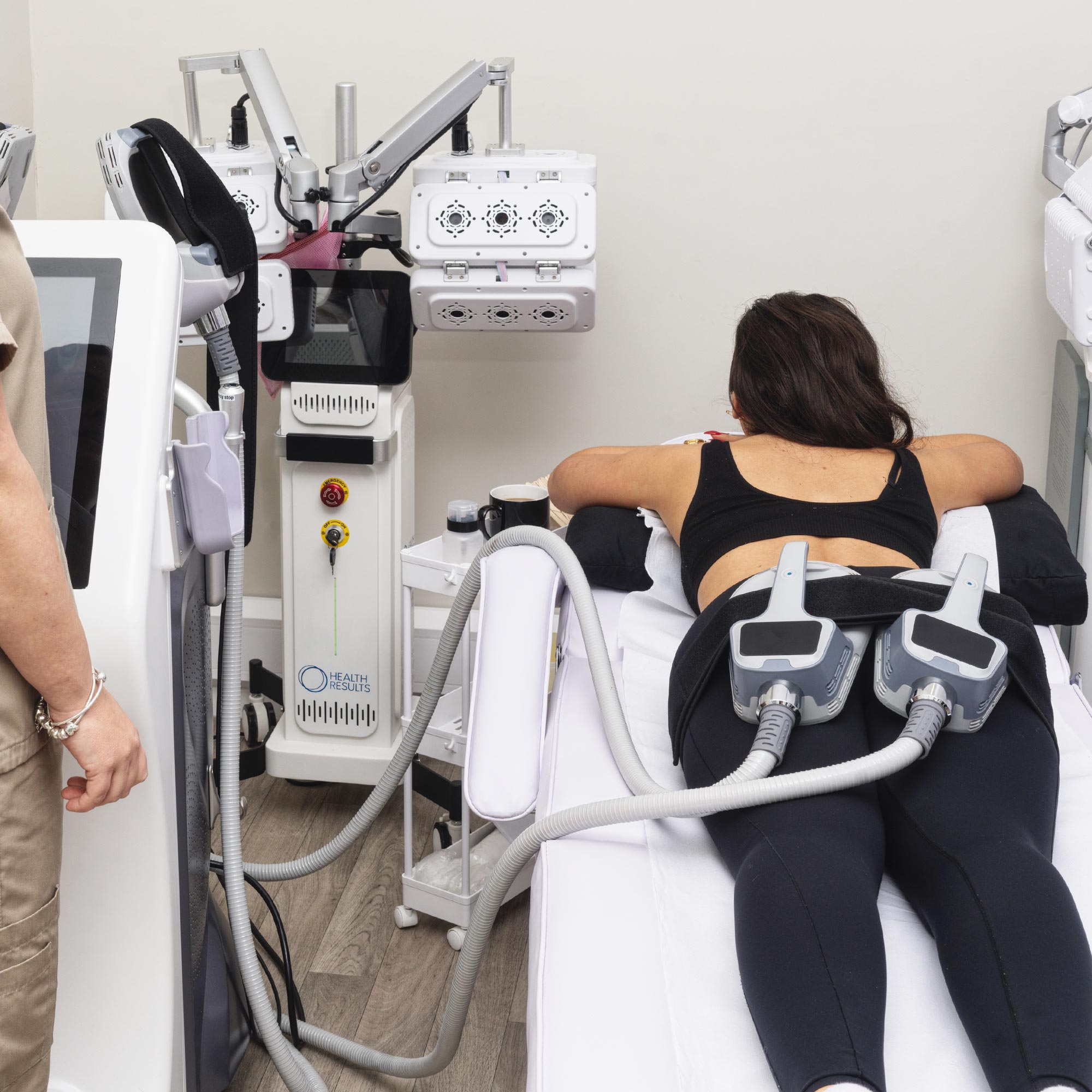 Woman using a non invasive Brazilian butt lift machine